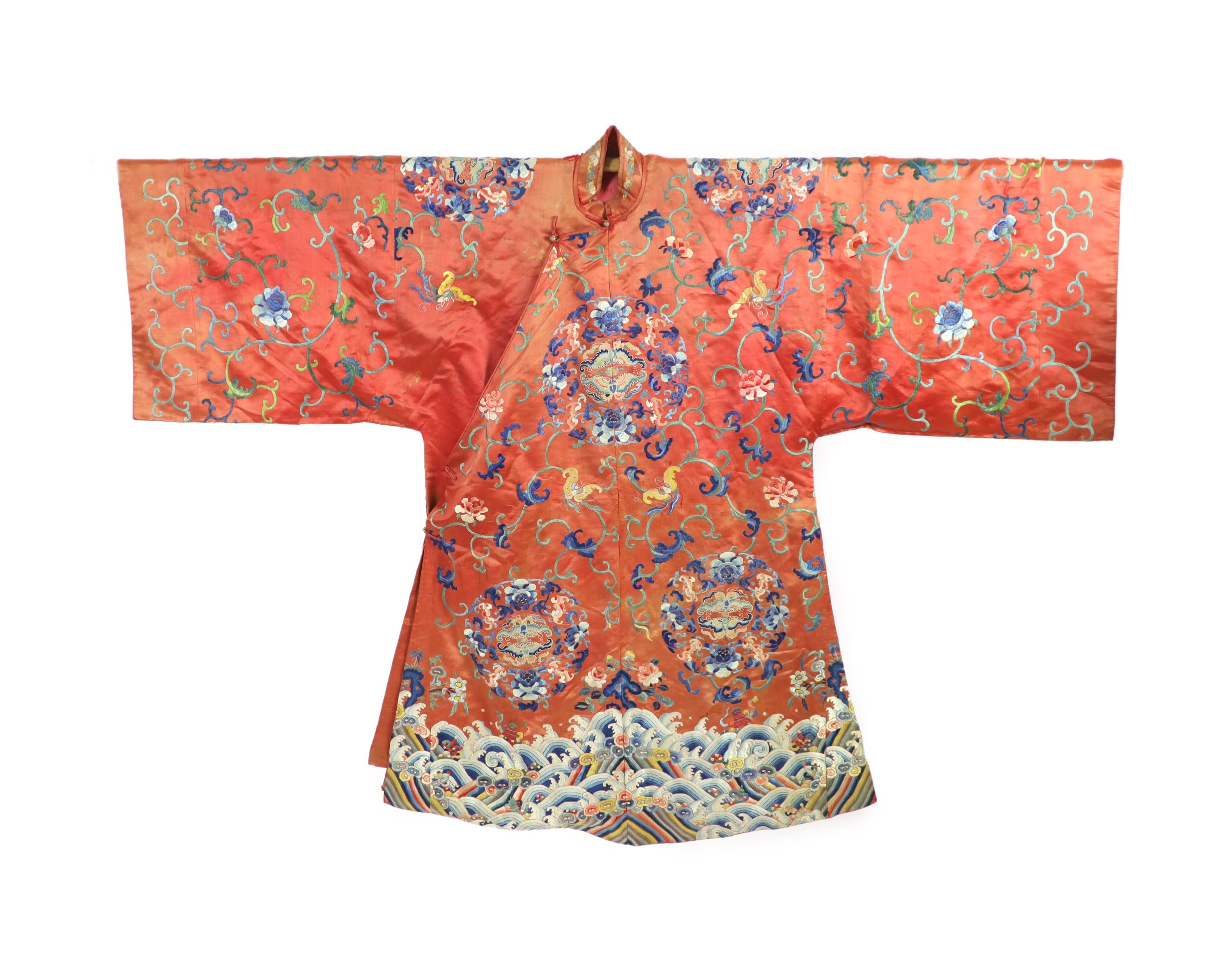 A Chinese apricot silk robe, mid 19th century, 125 cm long, wear to back of collar